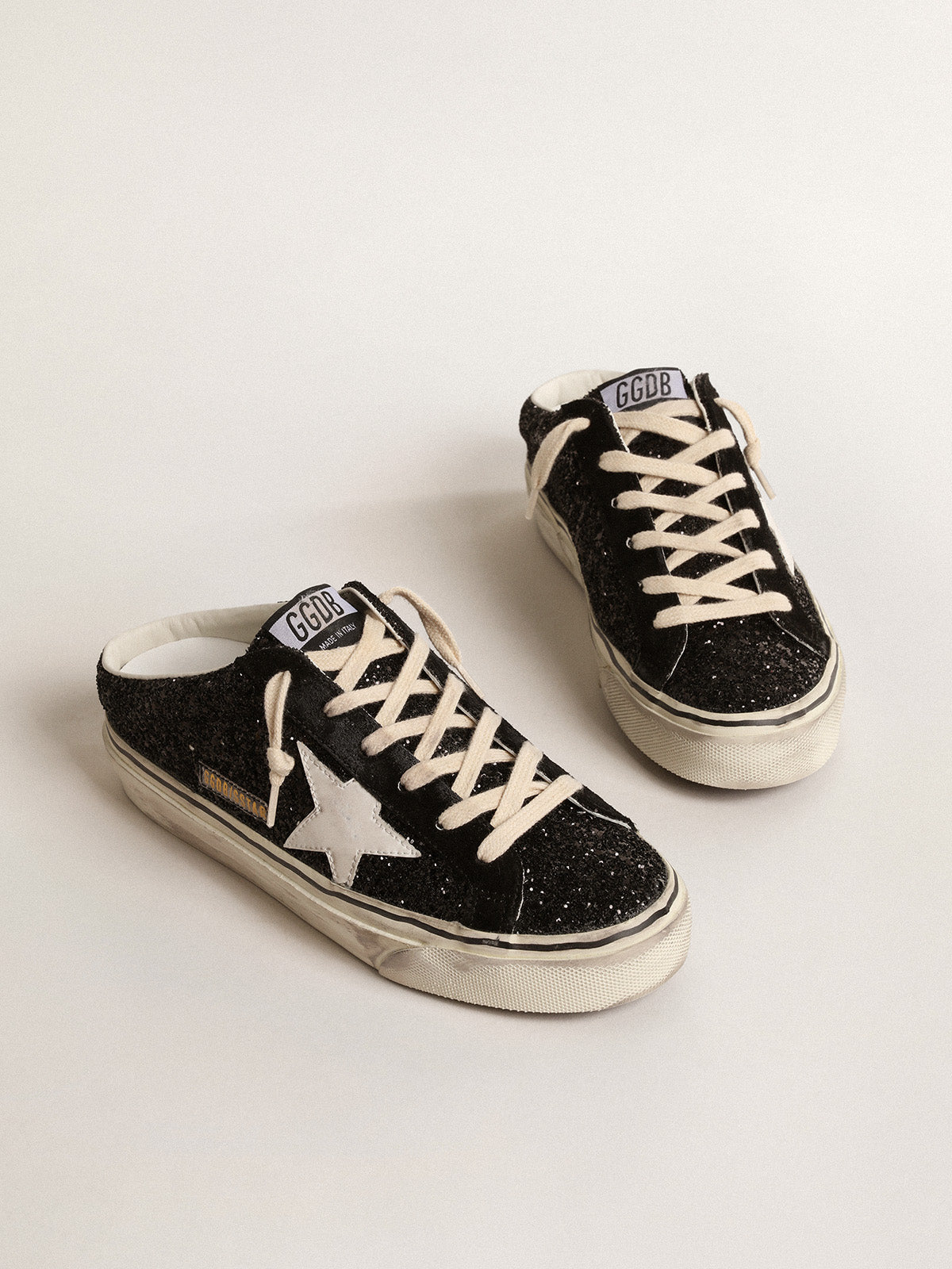 Super-Star Sabots in black glitter with white bio-based star| Golden Goose