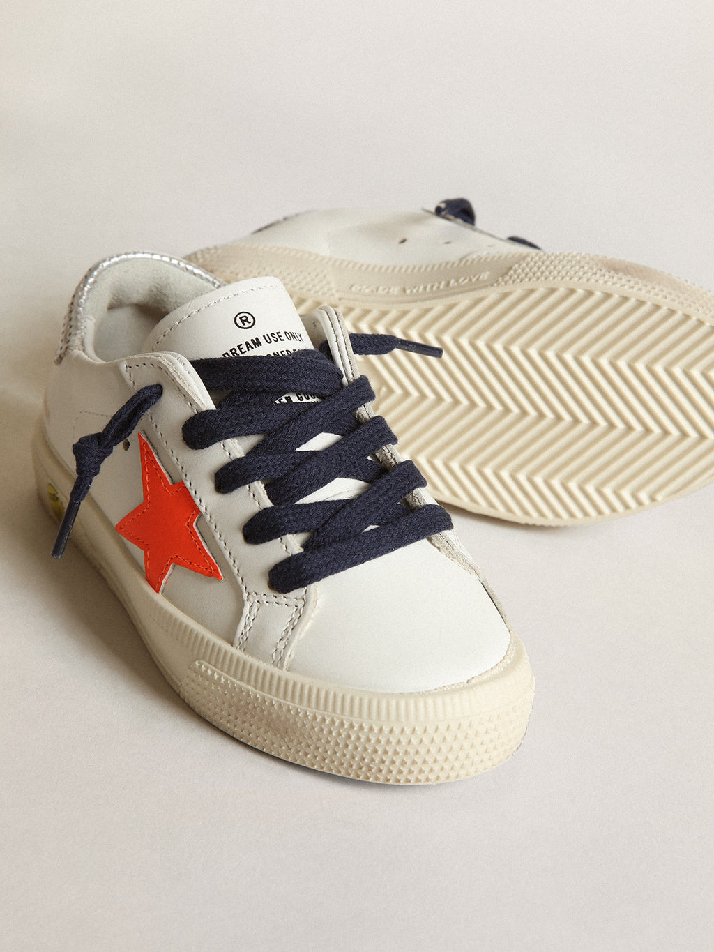 Young May with fluorescent orange leather star and perforated heel| Golden Goose