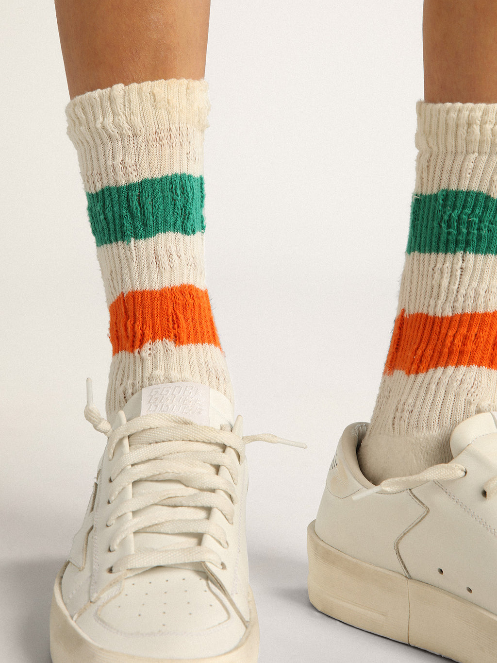 Distressed-finish white socks with green and orange stripes| Golden Goose