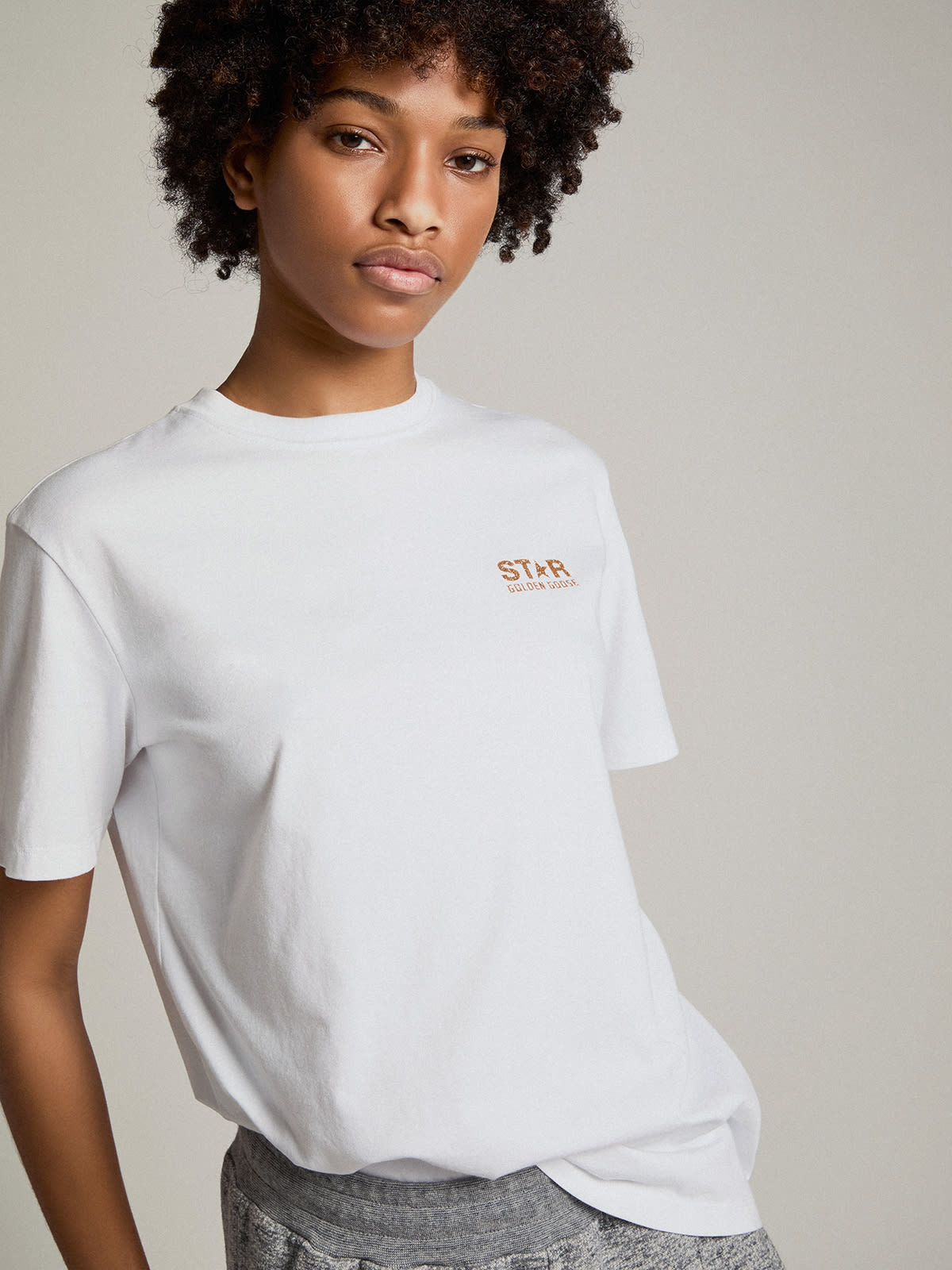 Women's white T-shirt with gold glitter logo and star| Golden Goose