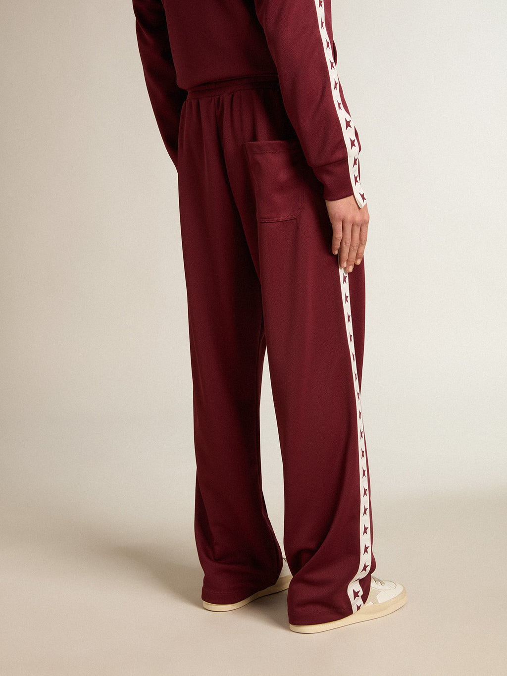 Men's burgundy joggers with stars on the sides| Golden Goose