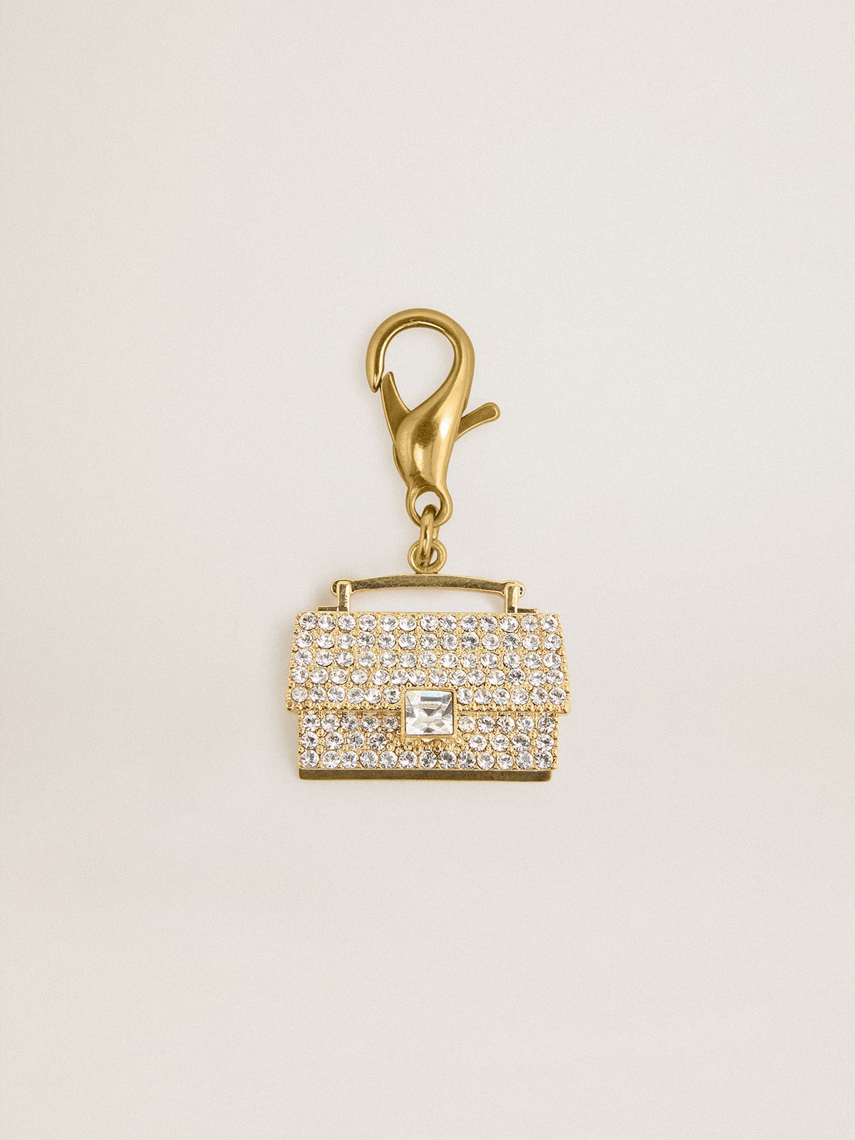Purse-shaped charm in gold-colored brass with crystals| Golden Goose