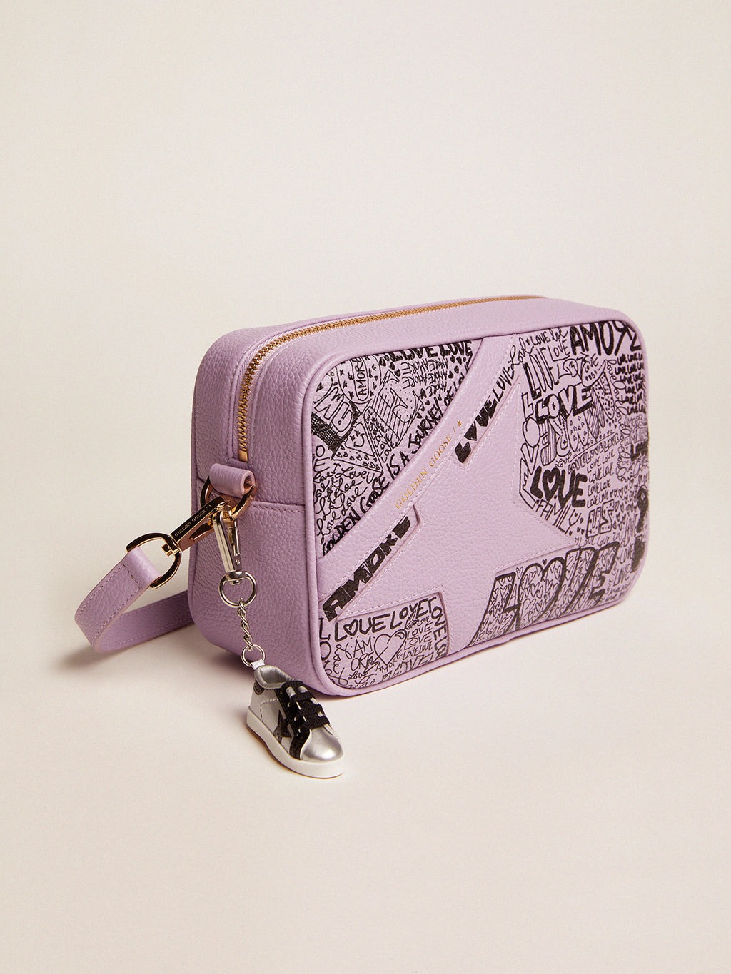 Lilac hammered leather Star Bag with tone-on-tone leather star and black all-over graffiti print| Golden Goose