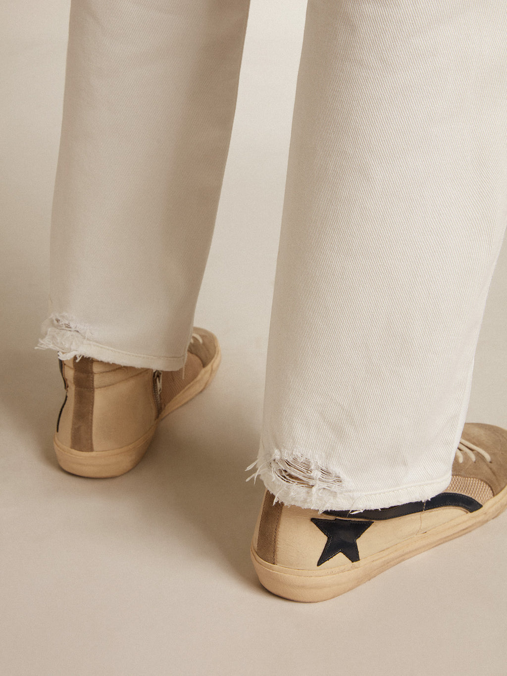 Stonewashed-effect white jeans| Golden Goose