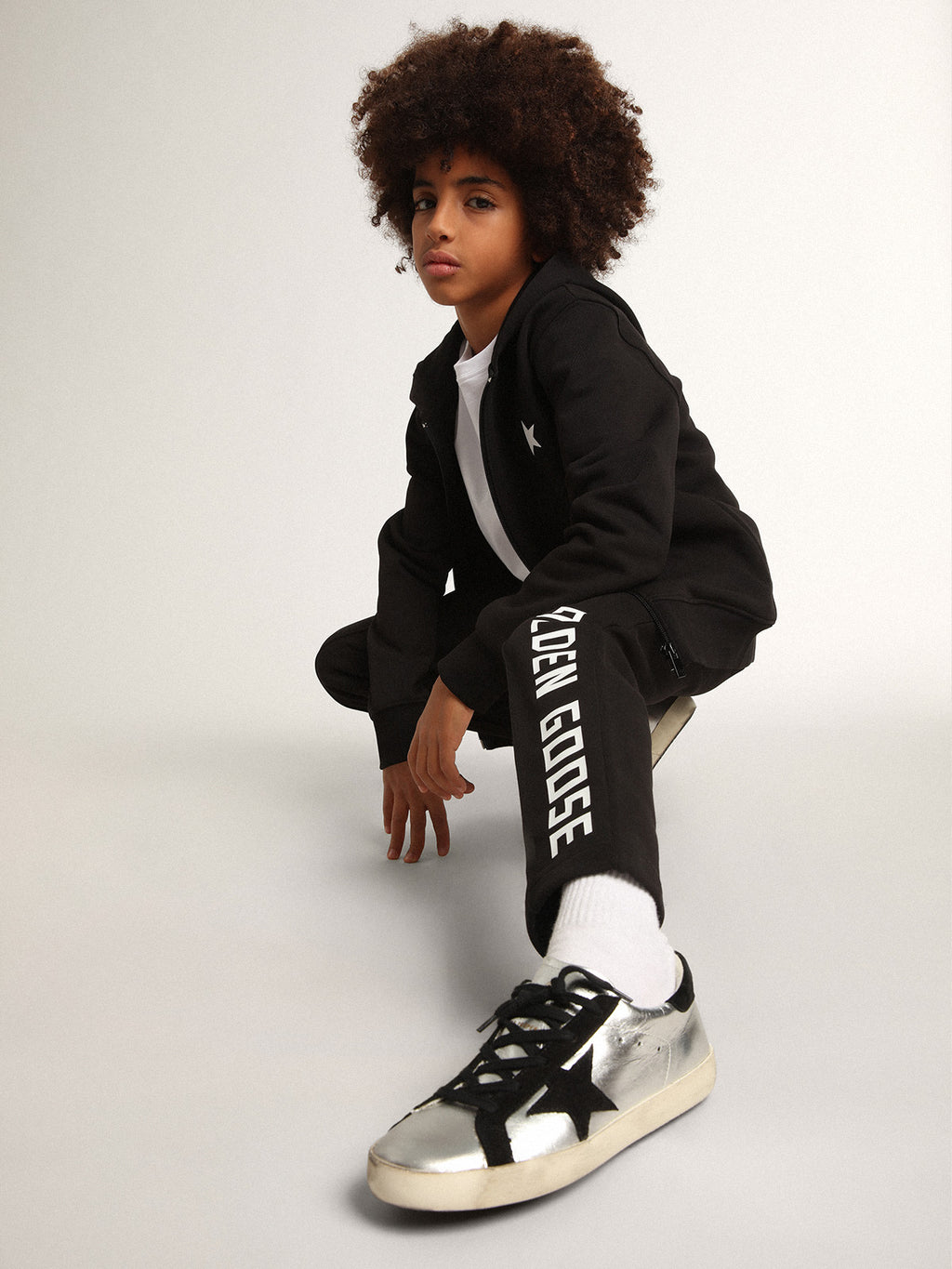 Black hooded sweatshirt with contrasting white star and logo| Golden Goose