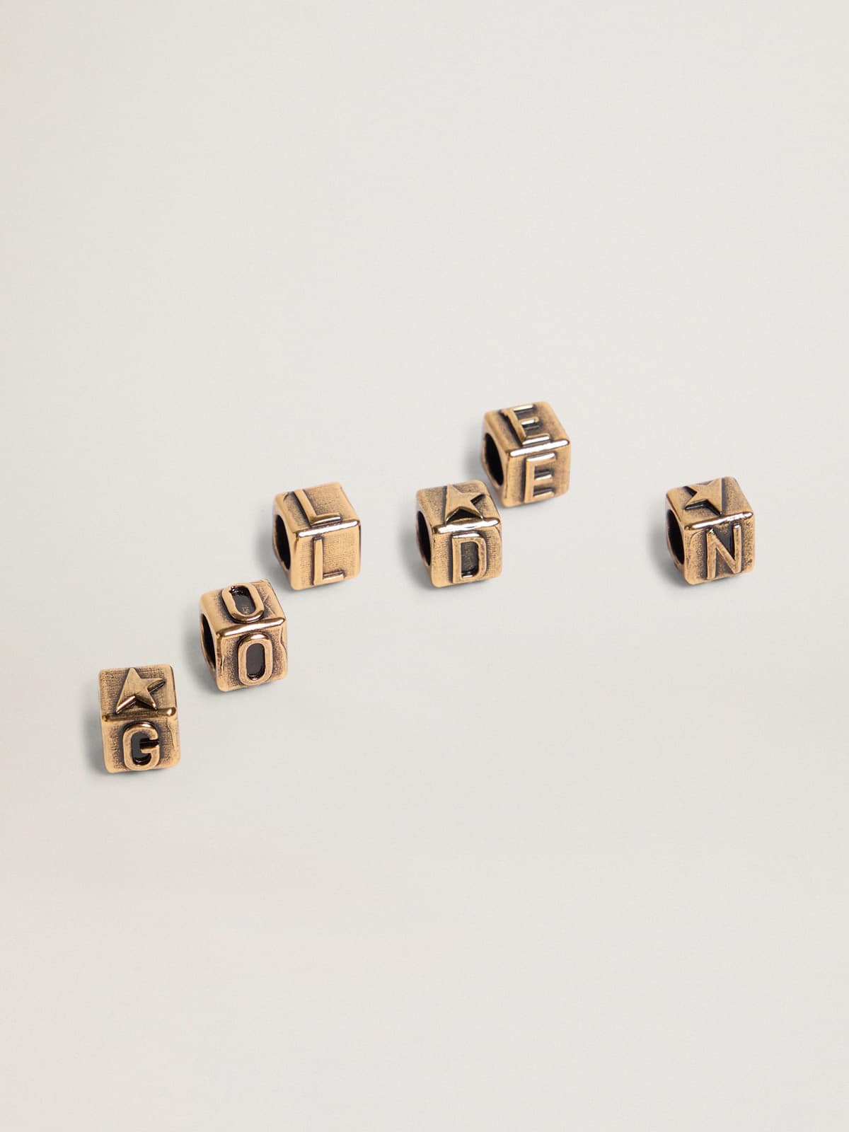 Women's cubic charms in antique gold color with letters of the alphabet| Golden Goose