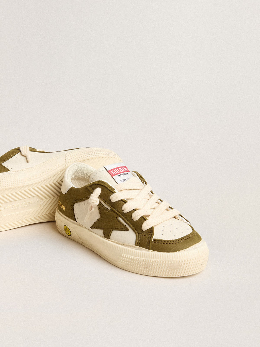 May Young in white and military green leather| Golden Goose