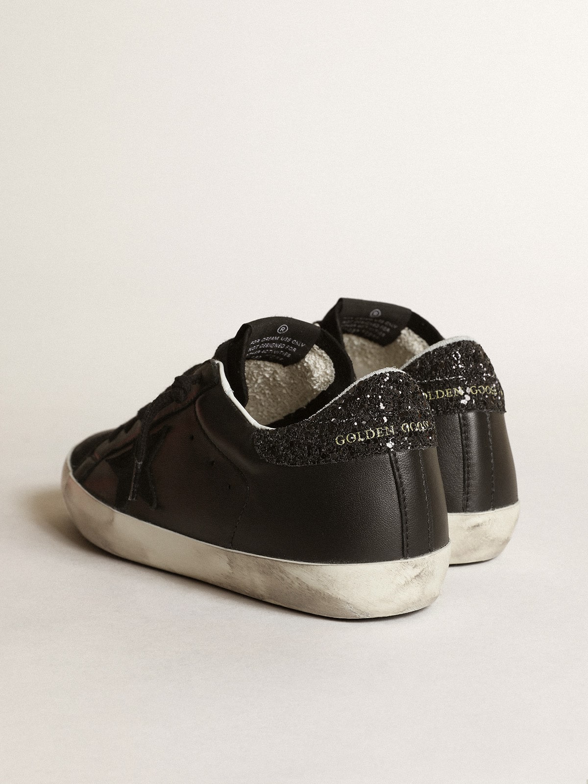 Women's Super-Star in black nappa with black star and glitter heel tab| Golden Goose