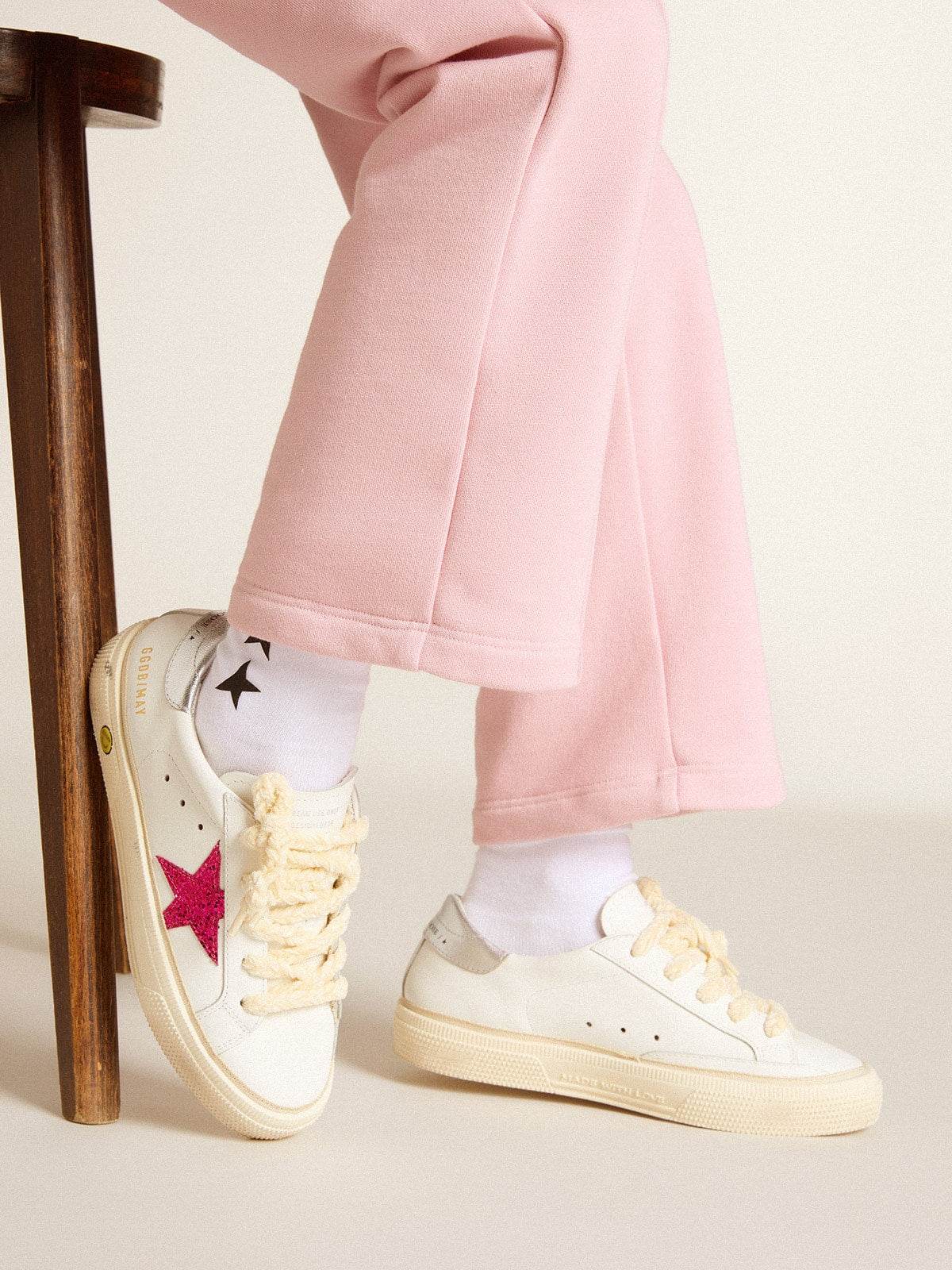May Young with fuchsia glitter star and metallic leather heel tab| Golden Goose