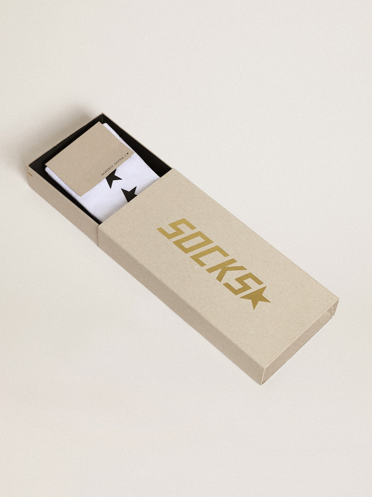 Worn white socks with contrasting black stars| Golden Goose