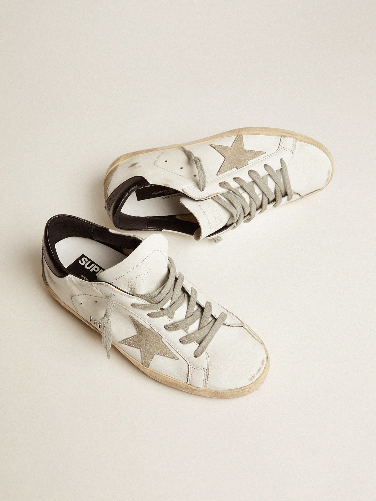 Women's Super-Star with black heel tab and metal stud lettering| Golden Goose