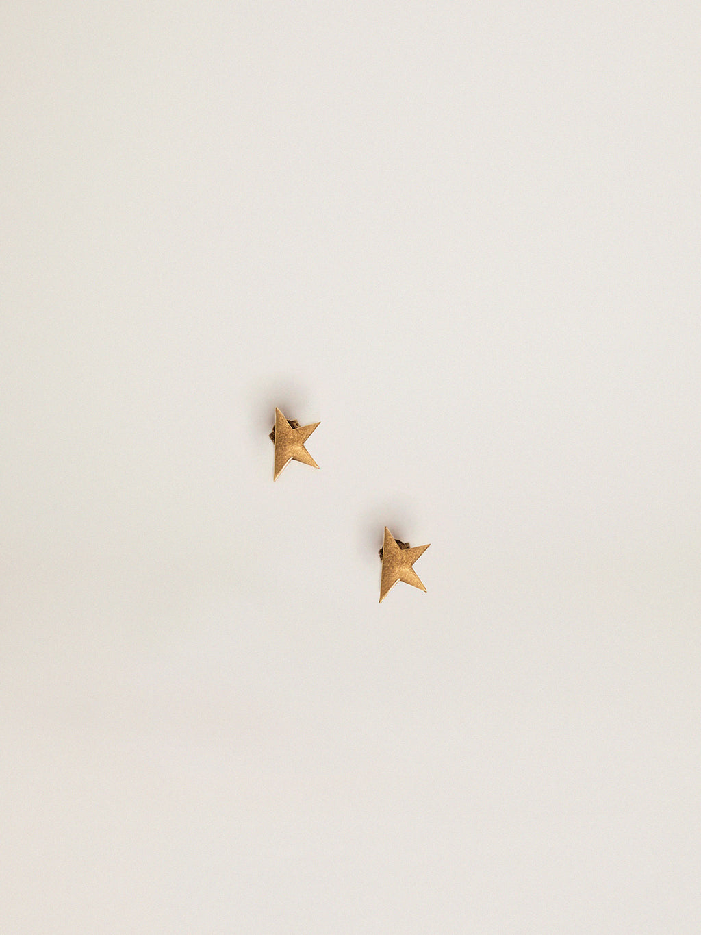 Women's stud earrings in antique gold color| Golden Goose