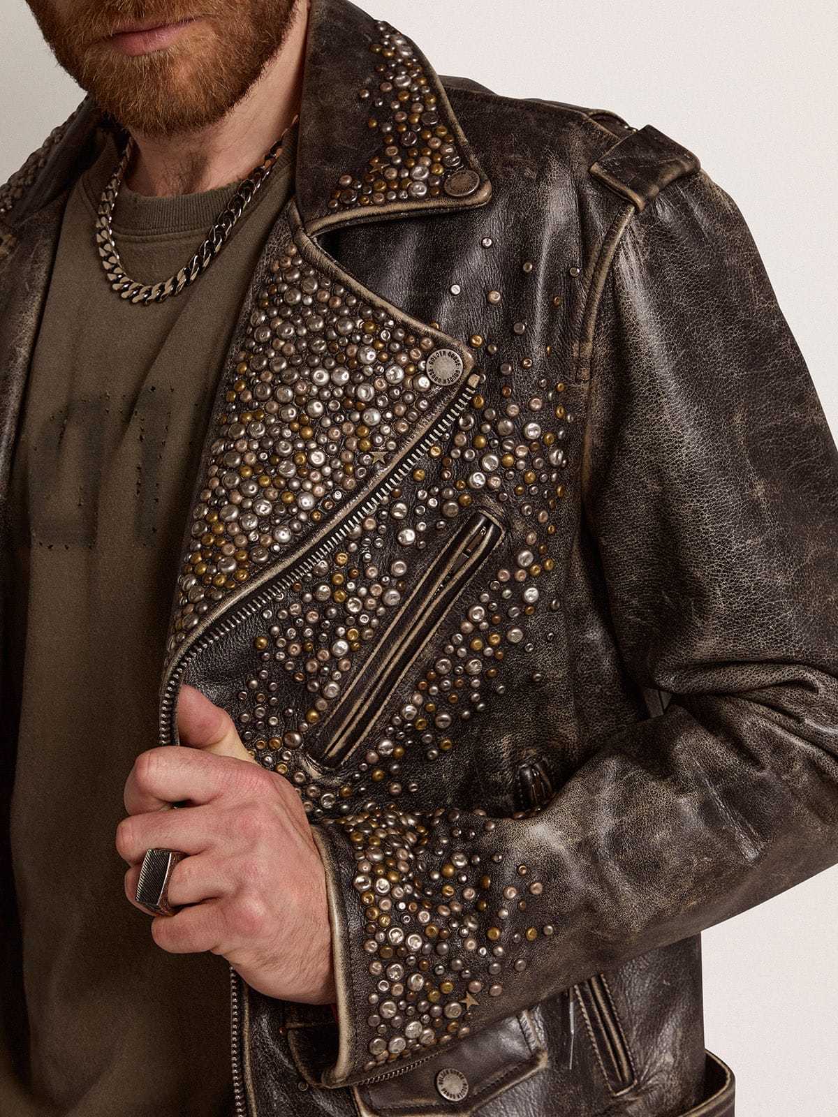 Men's leather biker jacket with hammered studs and adhesive tape| Golden Goose