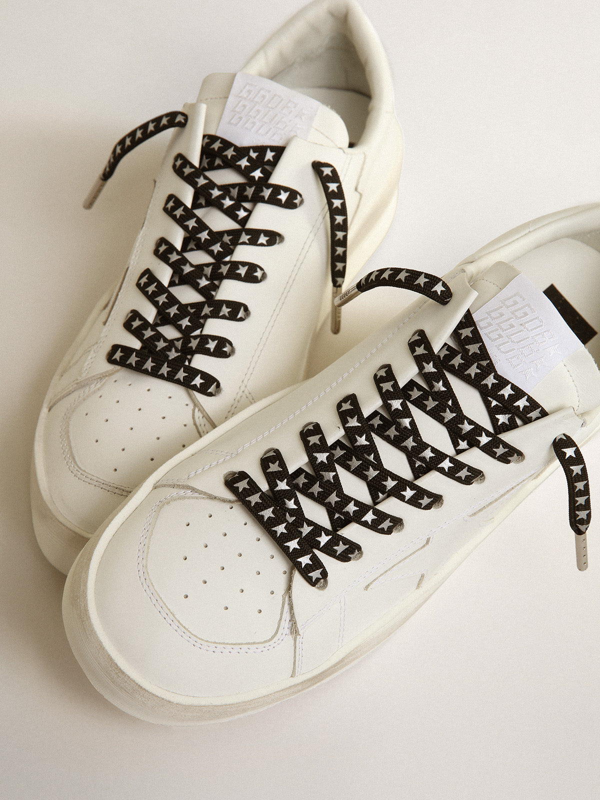 Black laces with contrasting silver stars| Golden Goose