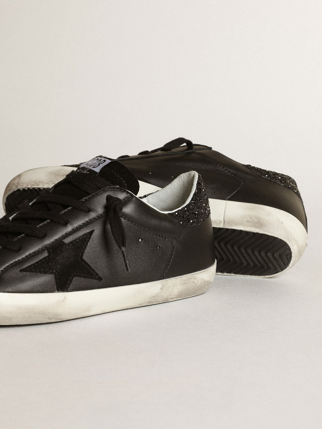 Super-Star in black nappa with black star and glitter heel tab| Golden Goose