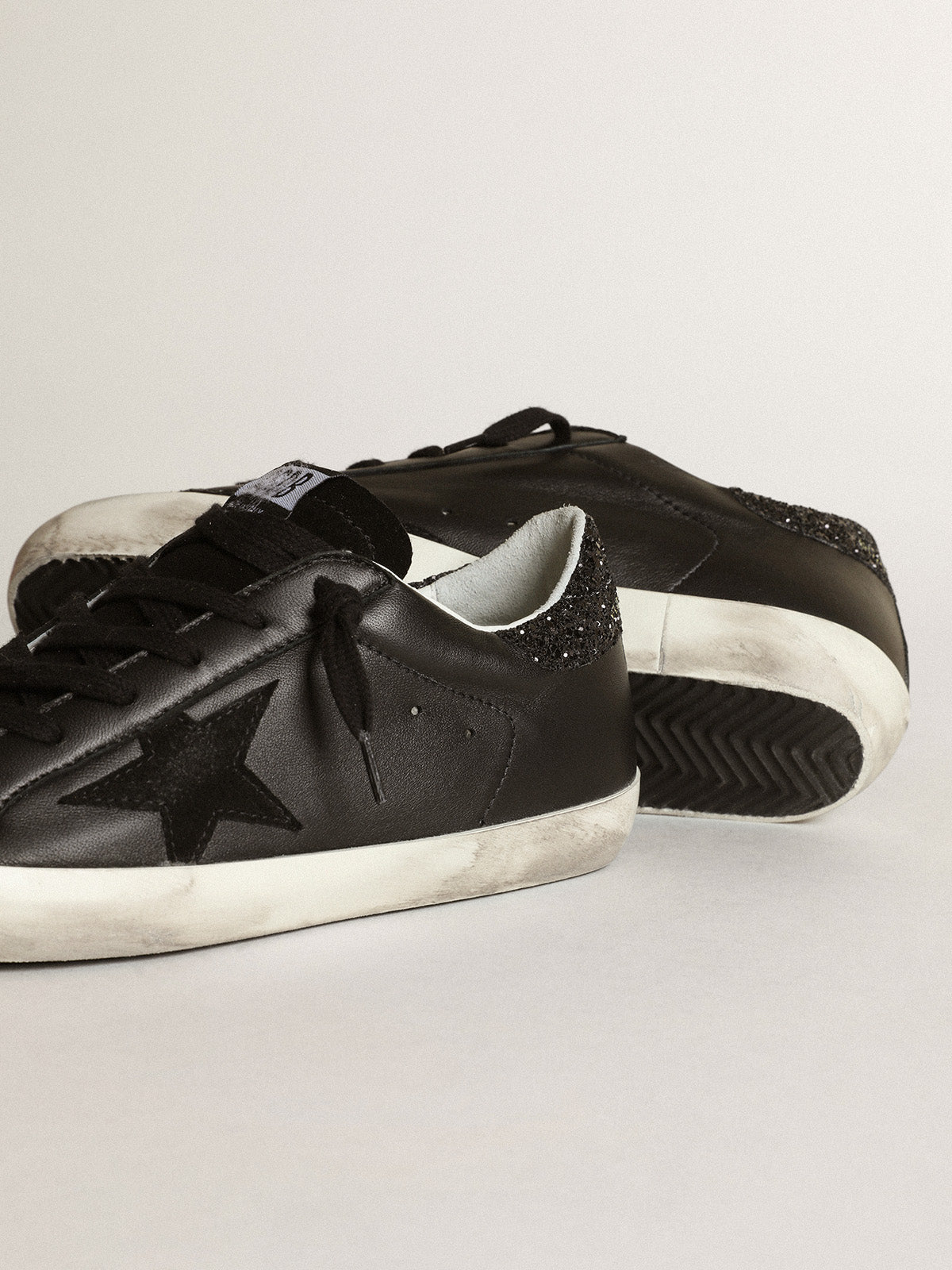 Super-Star in black nappa with black star and glitter heel tab| Golden Goose