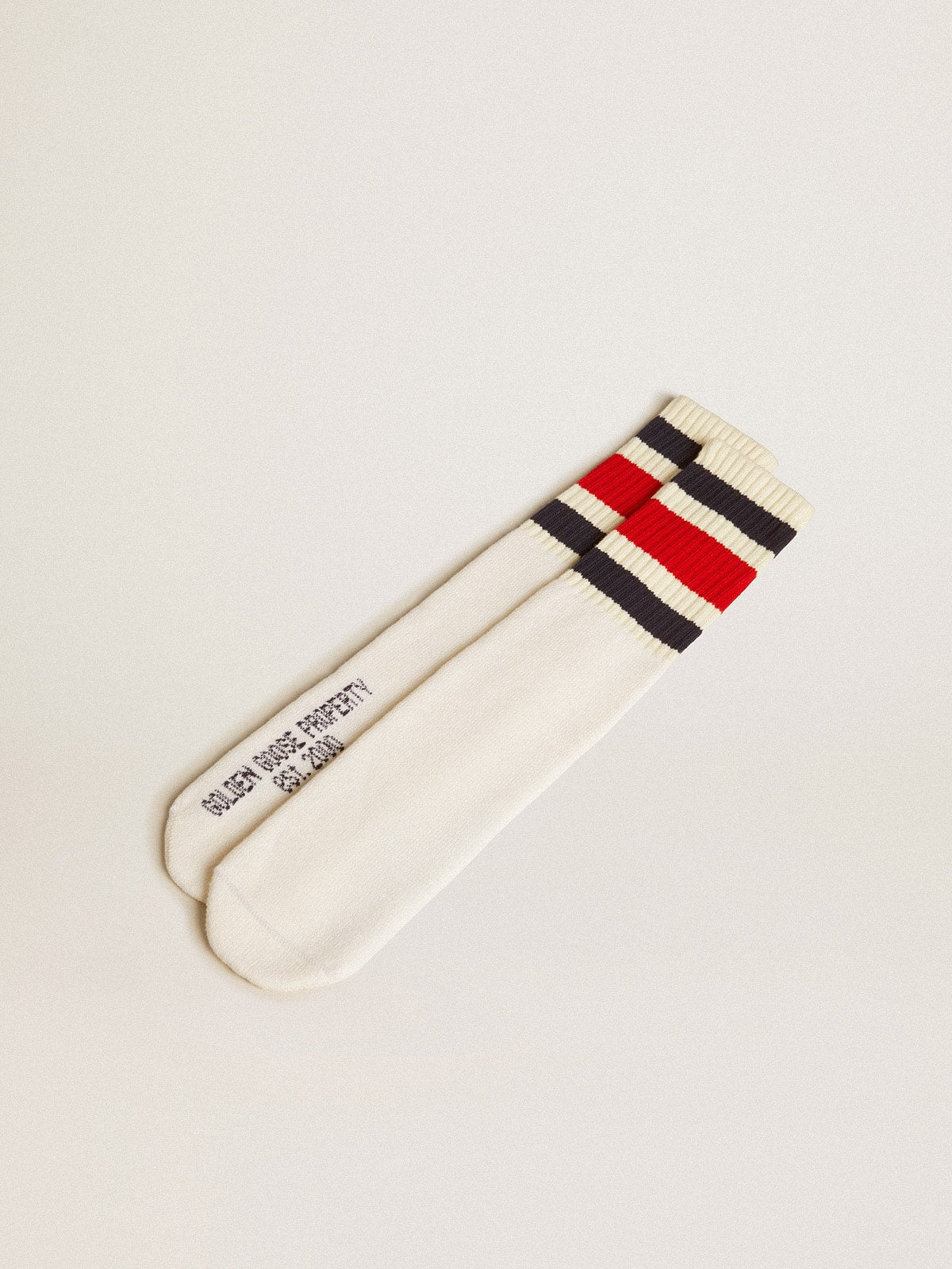 Worn-white socks with distressed details and black and red stripes| Golden Goose