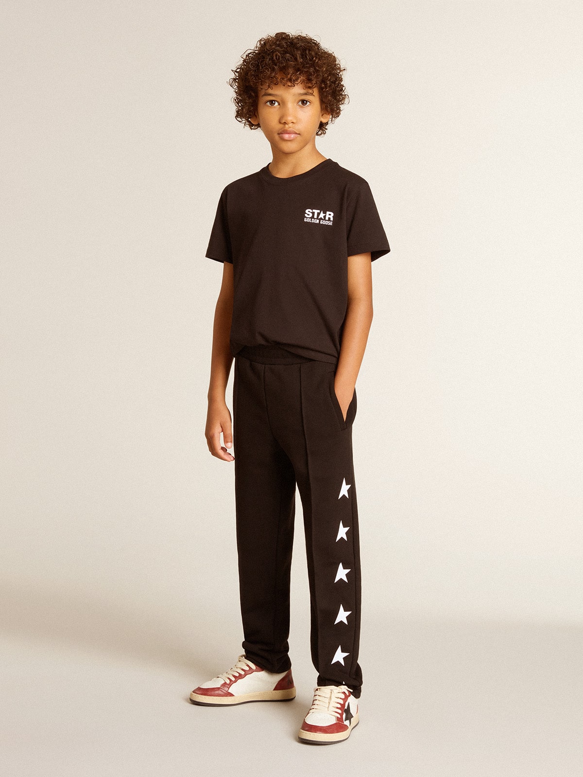 Black T-shirt with contrasting white logo on the front and maxi star on the back| Golden Goose