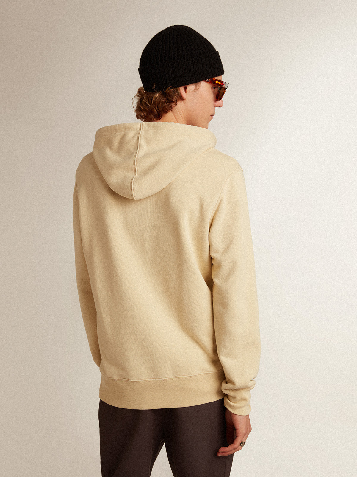 Marzipan-colored sweatshirt with lettering on the front| Golden Goose