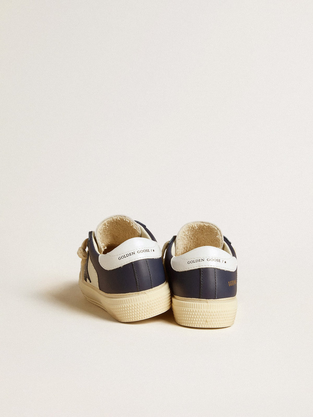 May Young in white and blue leather with leather star and heel tab| Golden Goose