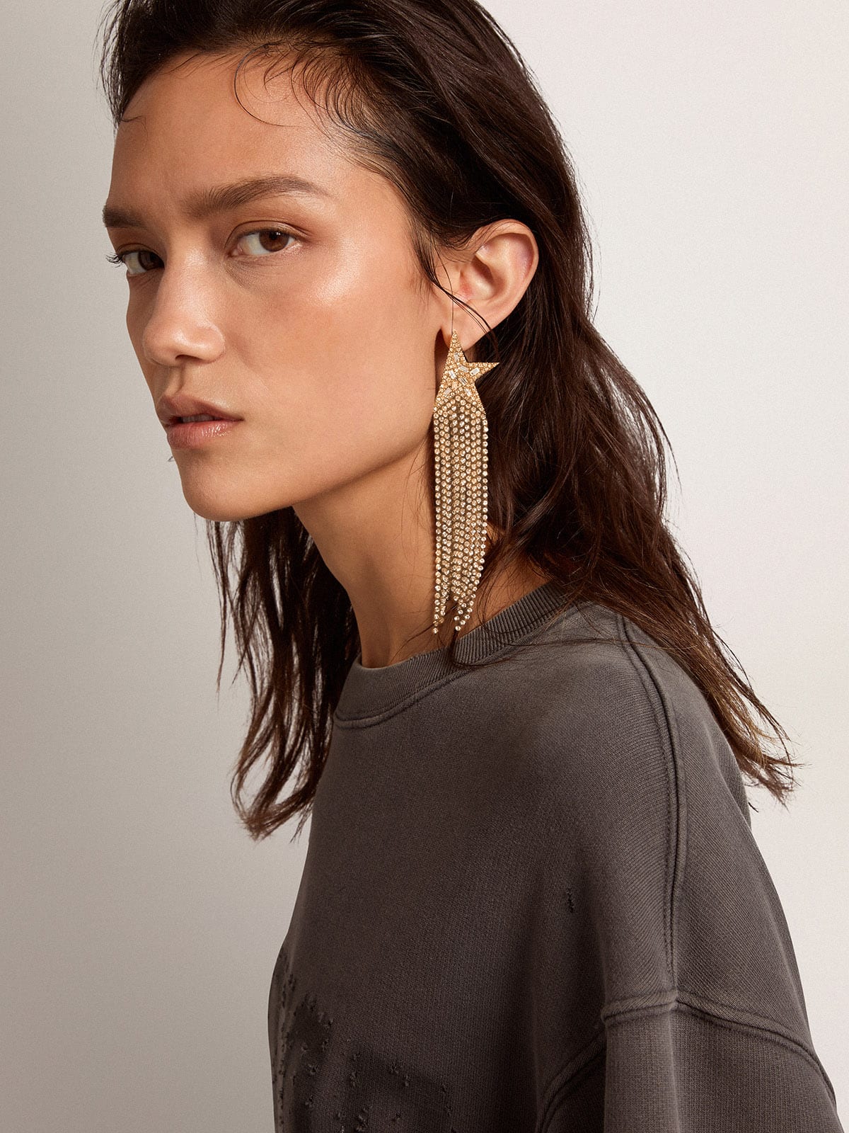 Women's single drop earring in antique gold color with decorative crystals| Golden Goose