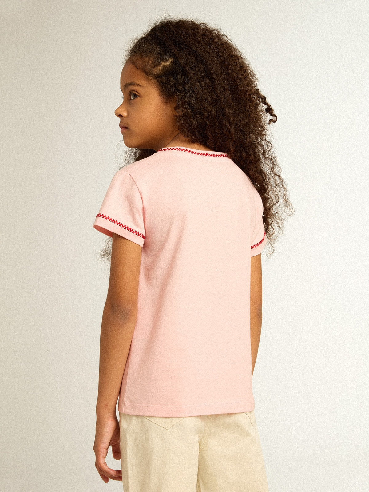 Pink T-shirt with red trim and embroidered flower on the heart| Golden Goose