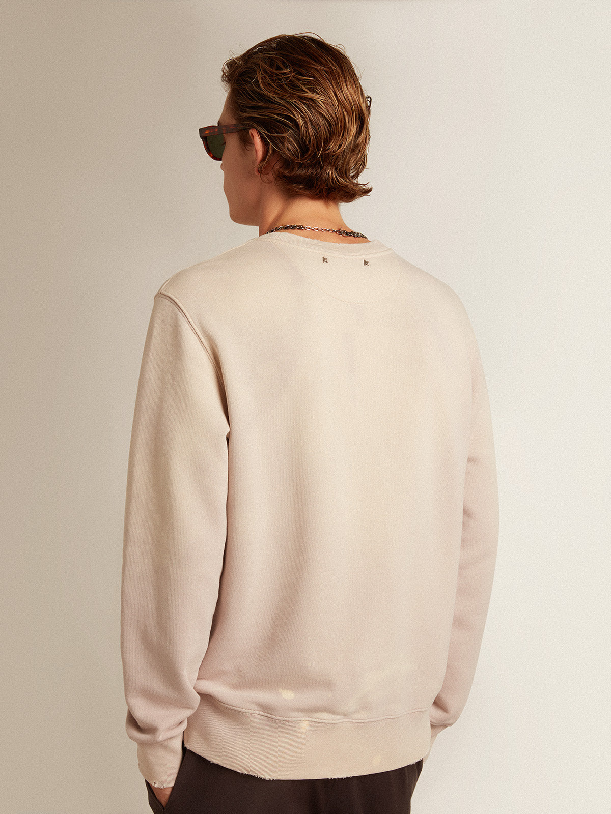 Distressed-finish pale pink sweatshirt| Golden Goose