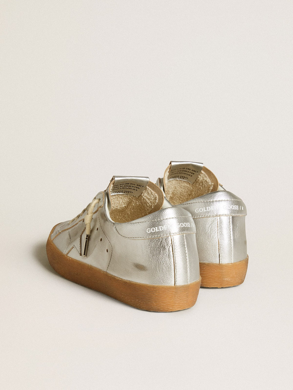 Super-Star in silver metallic leather with leather star and heel tab| Golden Goose