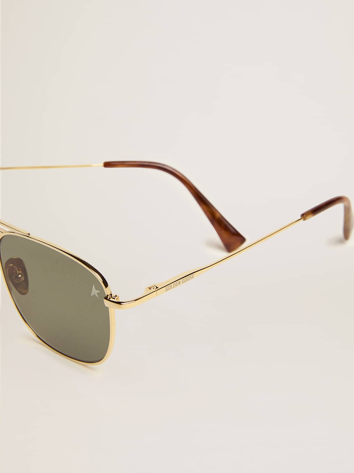 Aviator sunglasses with gold frame and green lenses| Golden Goose