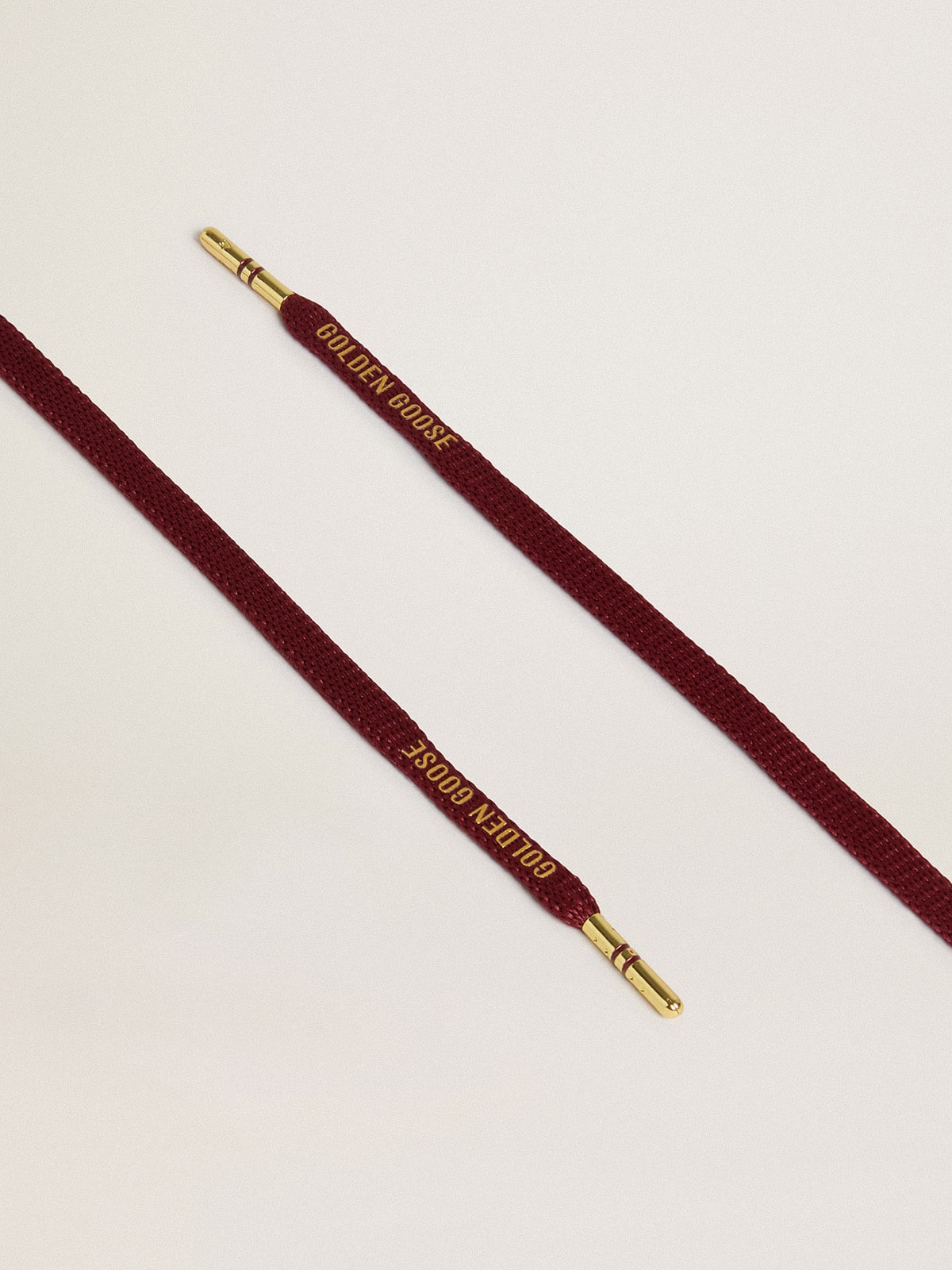 Burgundy cotton laces with contrasting gold-colored logo| Golden Goose