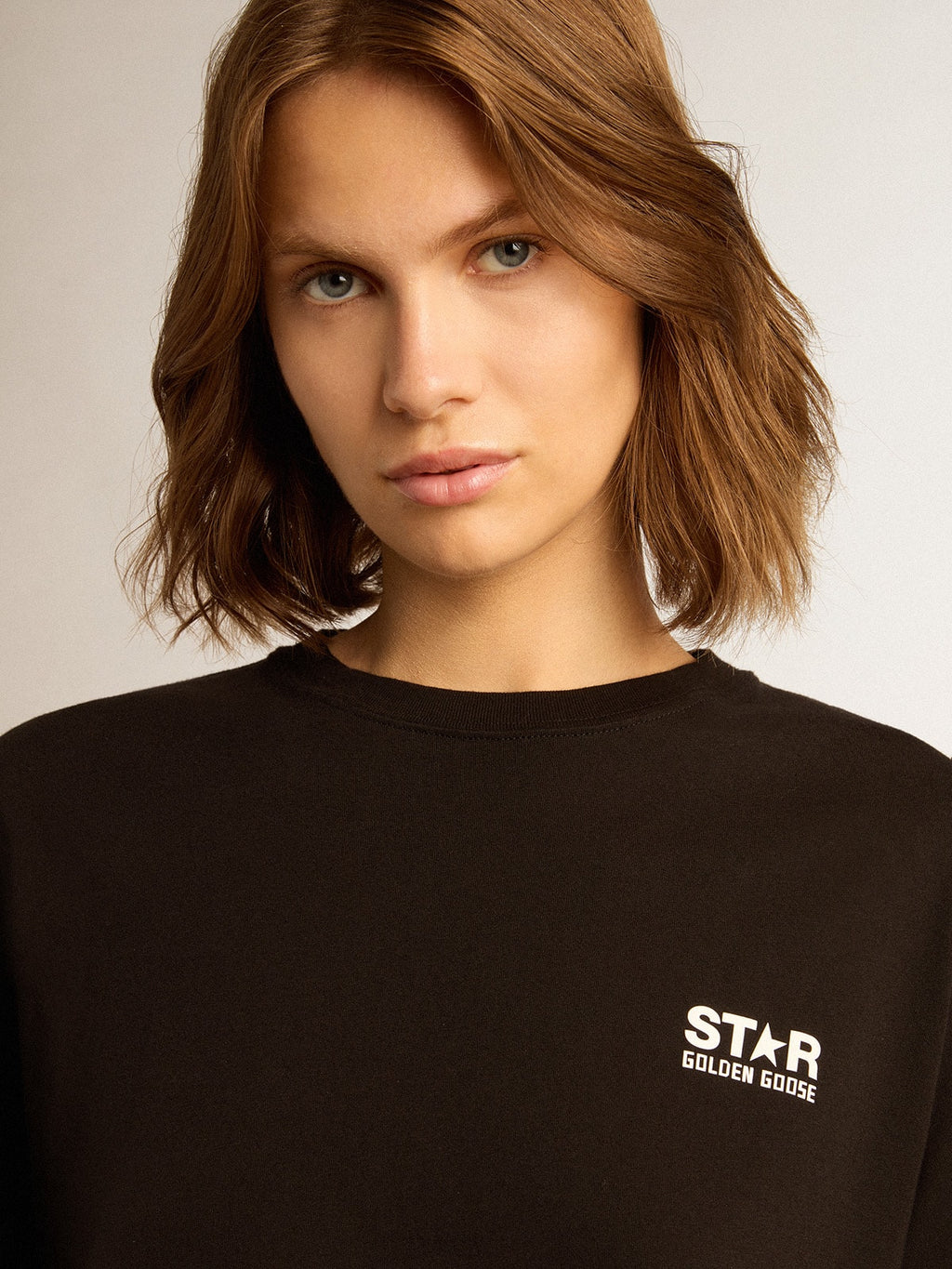 Black Star Collection T-shirt with contrasting white logo and star| Golden Goose
