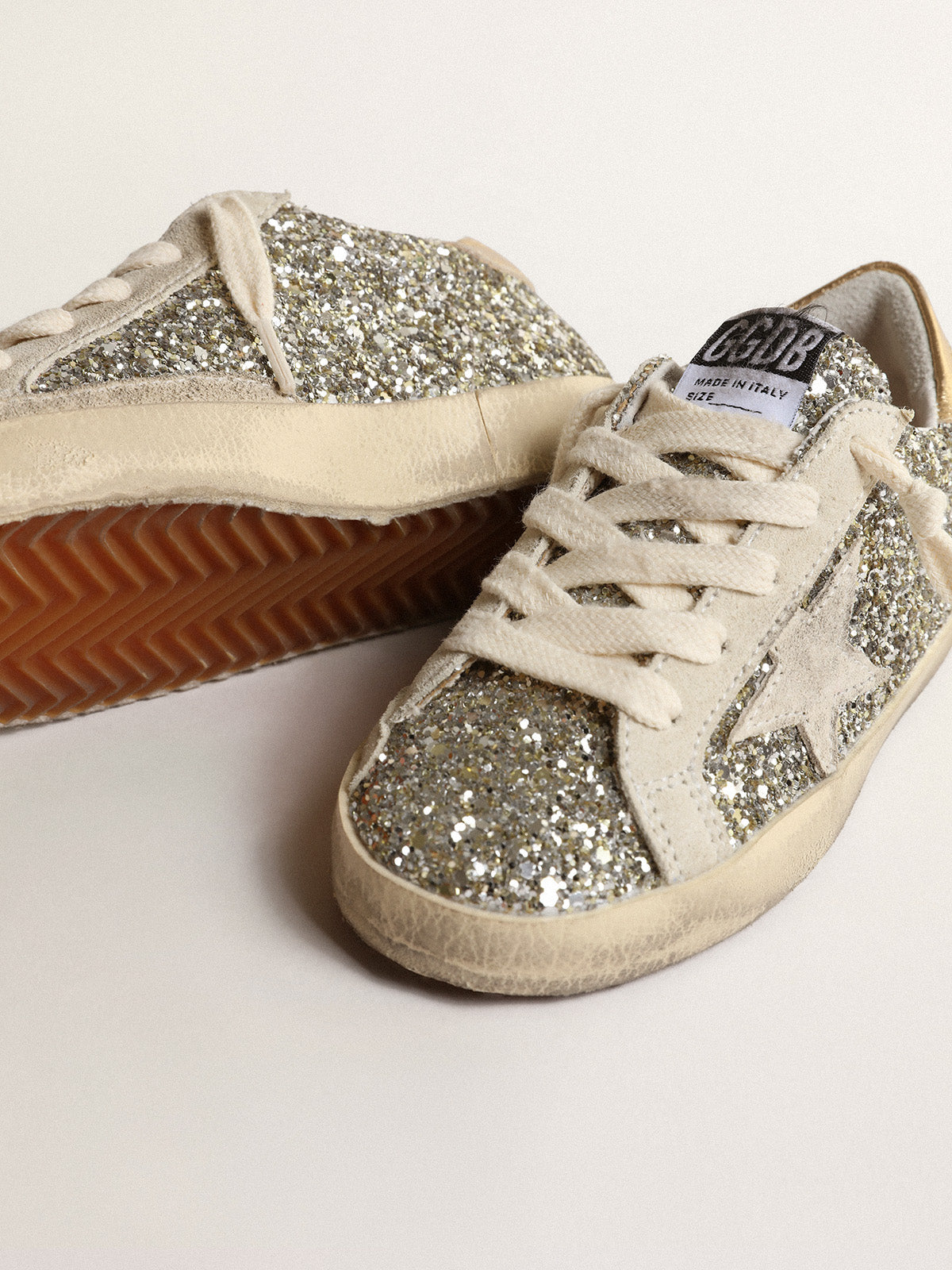 Super-Star Young in glitter with a suede star and gold heel tab| Golden Goose
