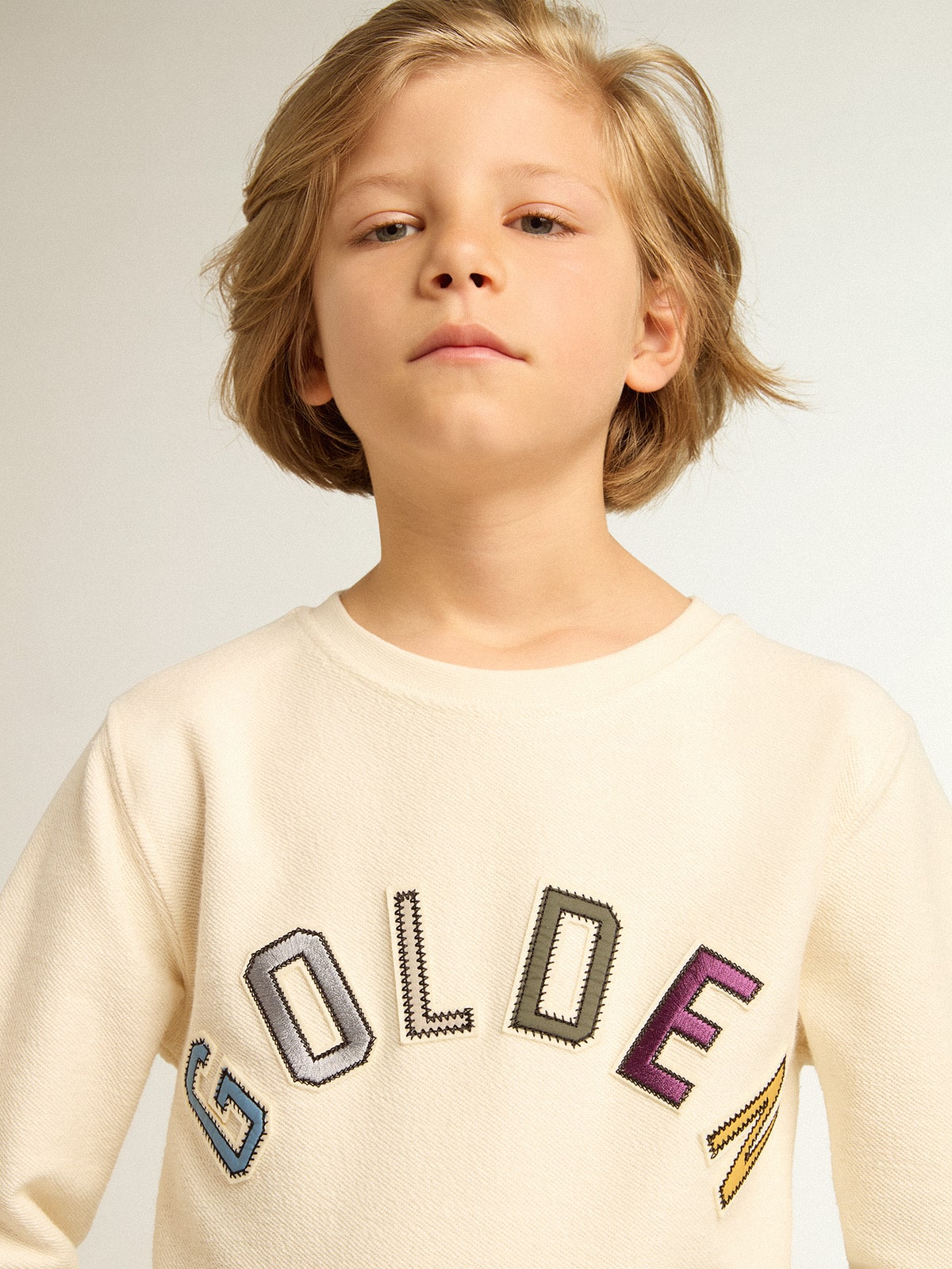 Sweatshirt in aged white with multicolor Golden lettering on the front| Golden Goose