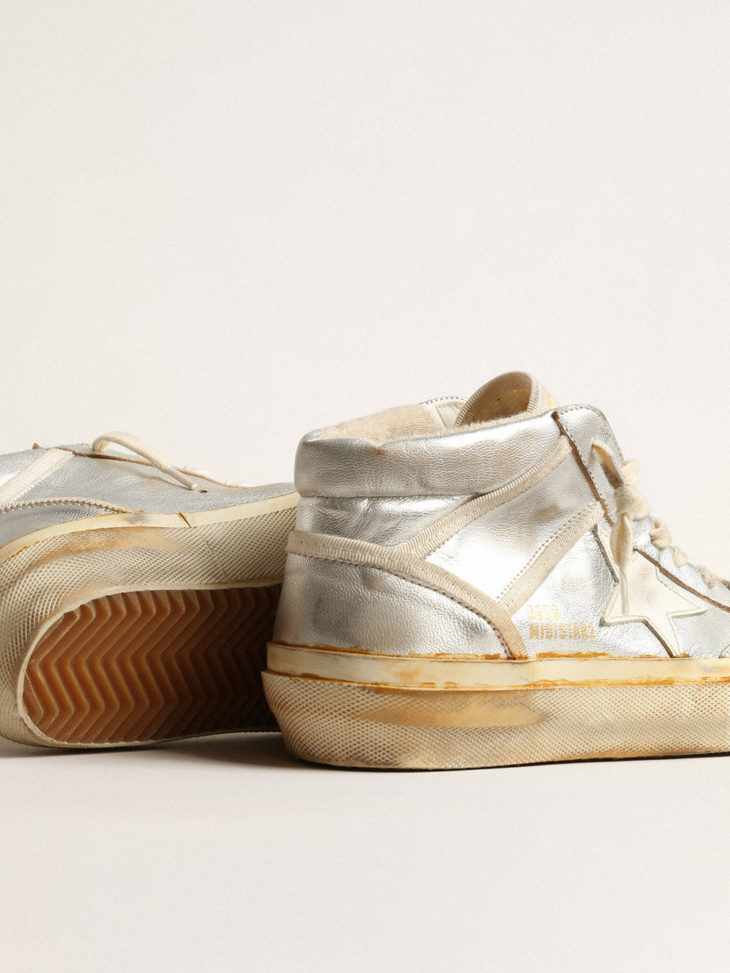 Women's Mid Star in silver metallic leather with ivory star| Golden Goose