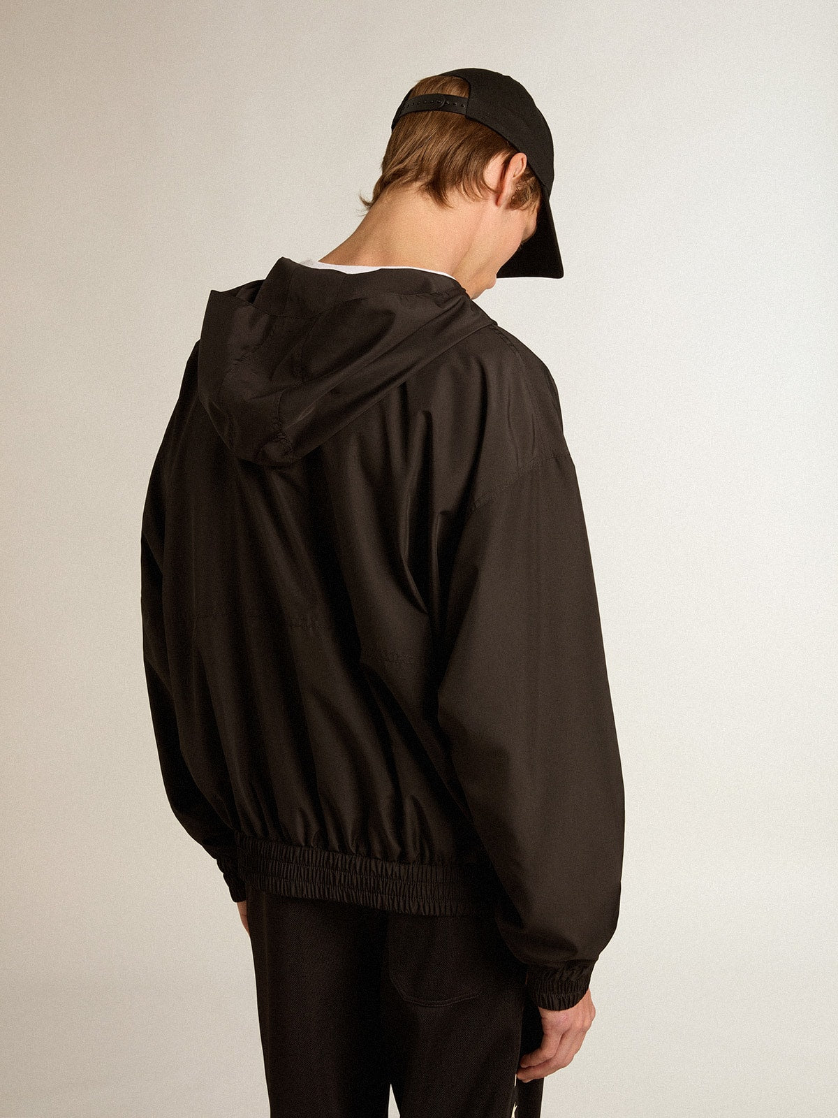 Black windbreaker with hood| Golden Goose