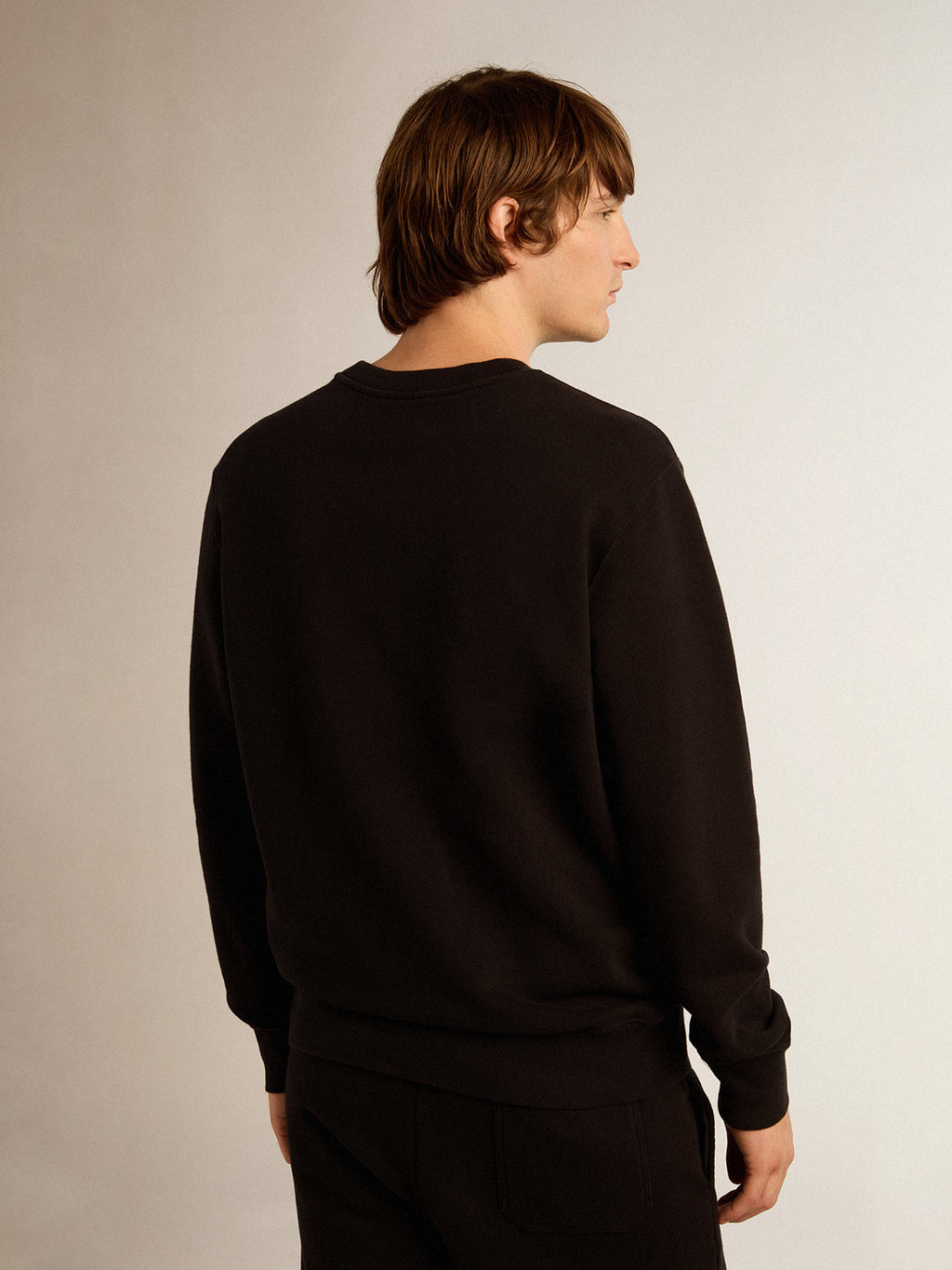 Black Archibald Star Collection sweatshirt with tone-on-tone star on the front| Golden Goose
