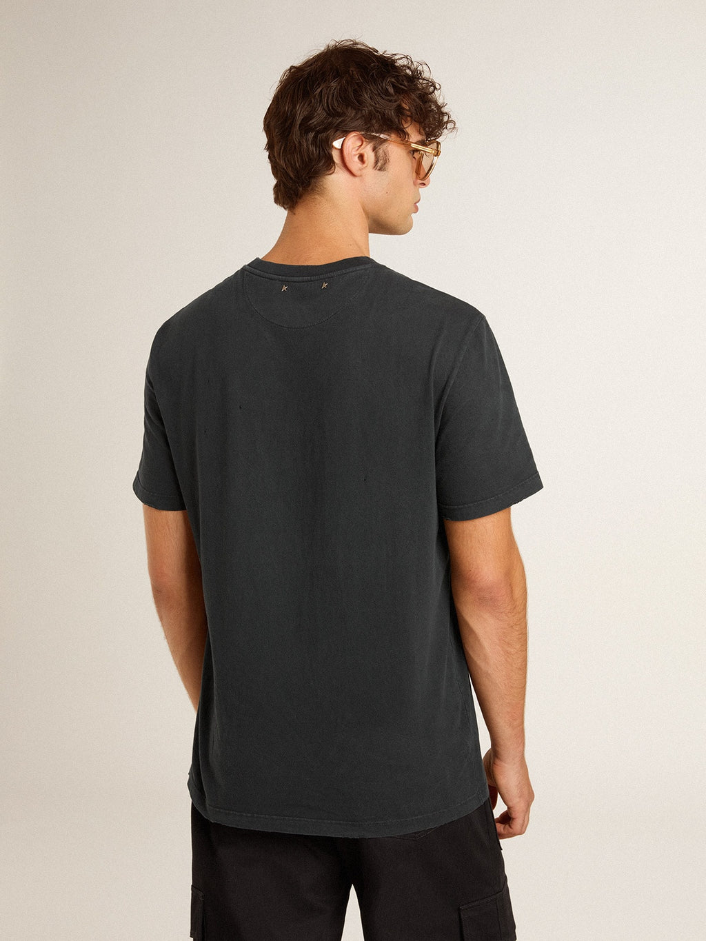 Men's worn-black cotton T-shirt with print on the front| Golden Goose