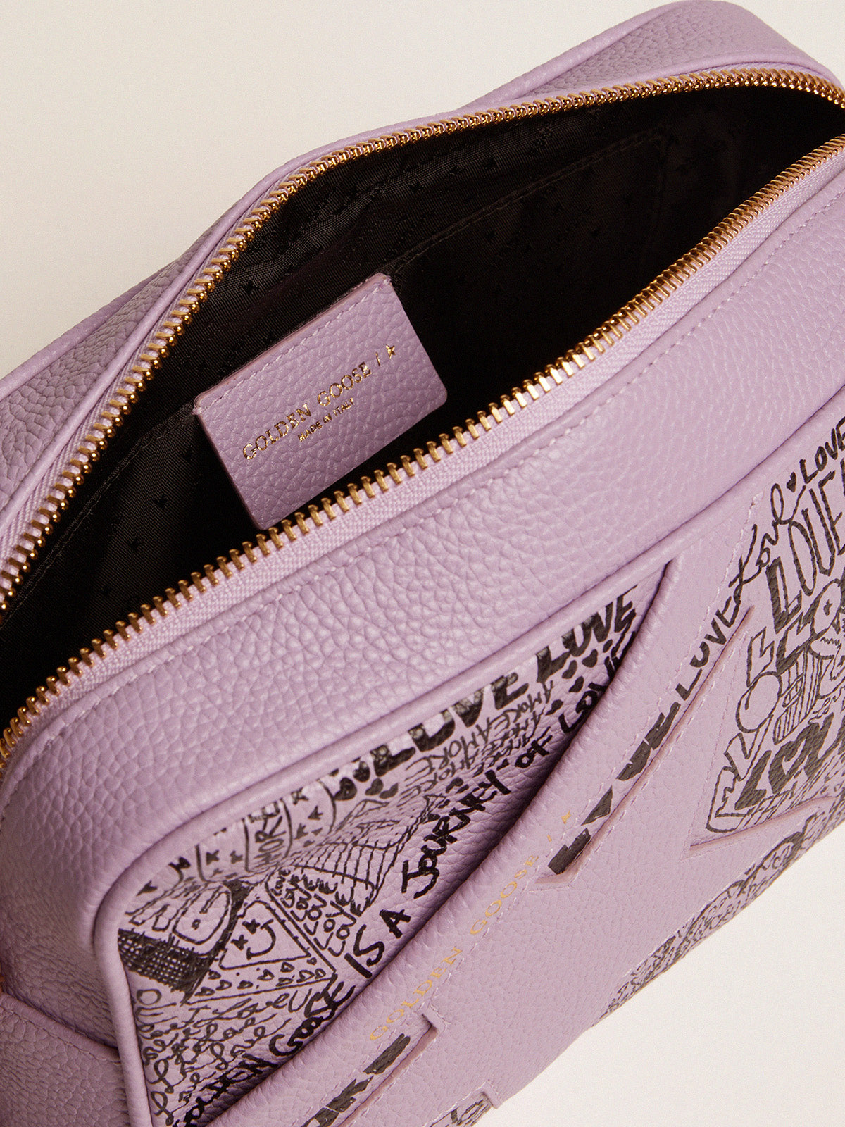 Lilac hammered leather Star Bag with tone-on-tone leather star and black all-over graffiti print| Golden Goose