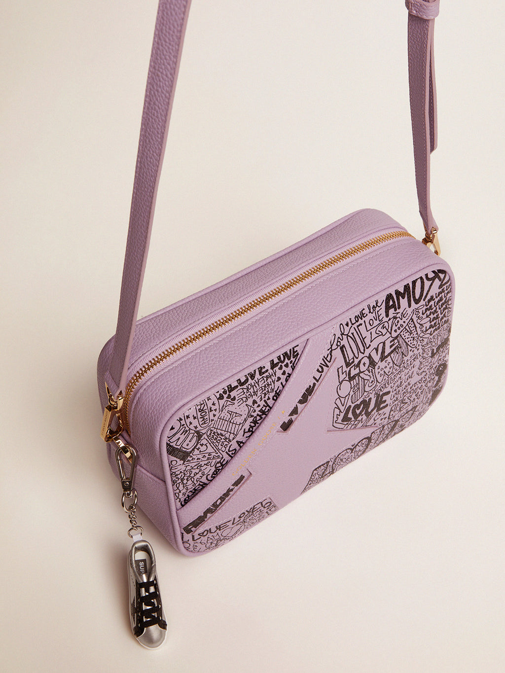 Lilac hammered leather Star Bag with tone-on-tone leather star and black all-over graffiti print| Golden Goose