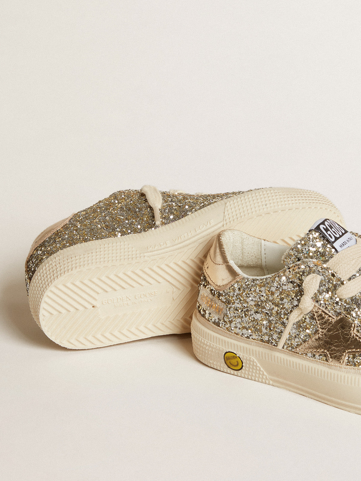 May Young in platinum glitter with metallic leather star and heel tab| Golden Goose