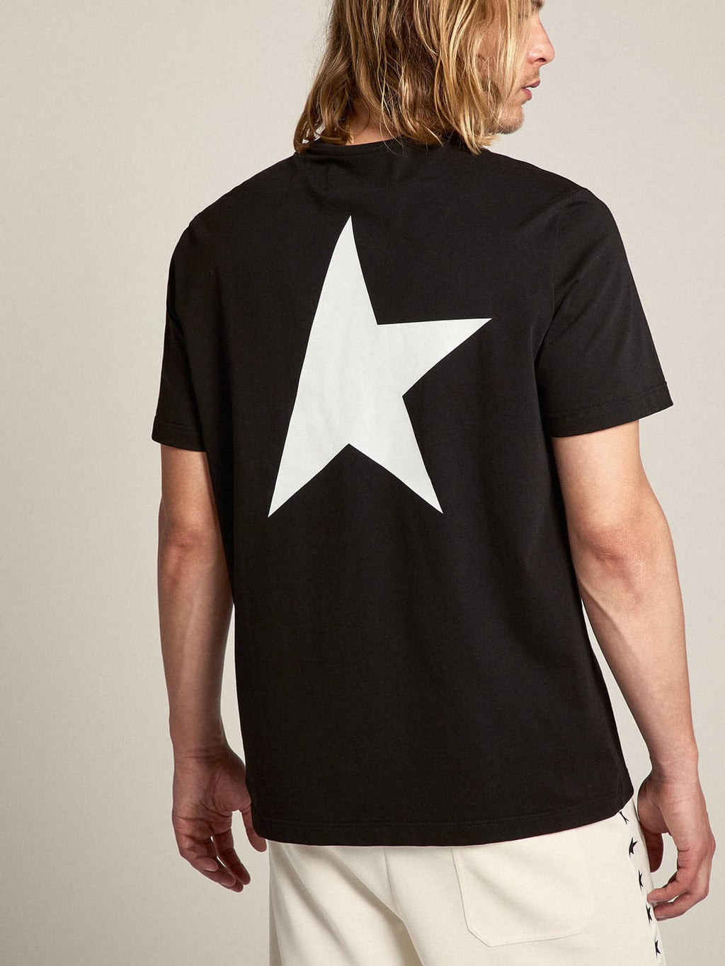 Men's black T-shirt with contrasting white logo and star| Golden Goose