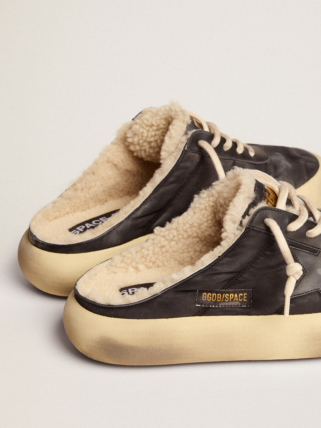 Men's Space-Star Sabot shoes in quilted black nylon with shearling lining| Golden Goose