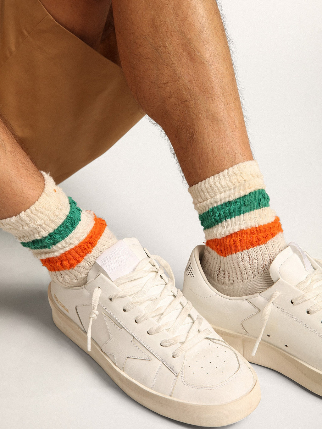 Distressed-finish white socks with green and orange stripes| Golden Goose