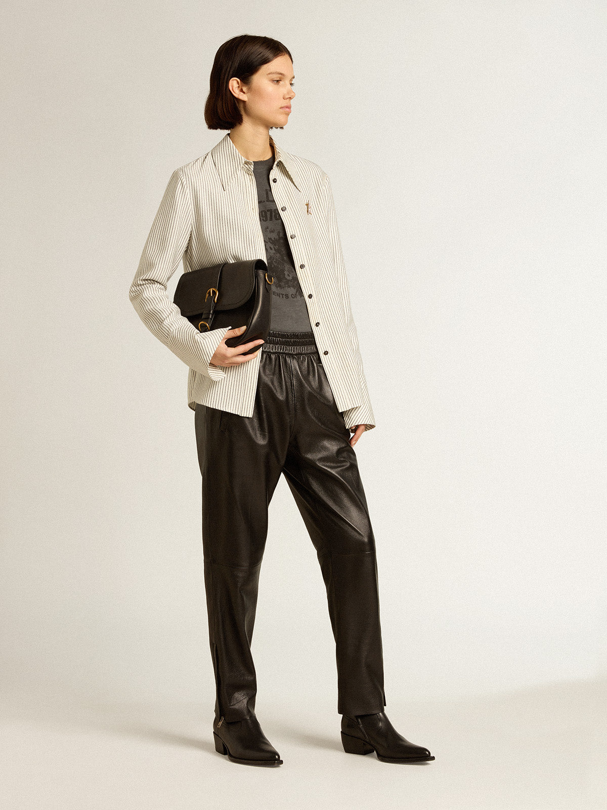 Black joggers in nappa leather with zip at the base| Golden Goose