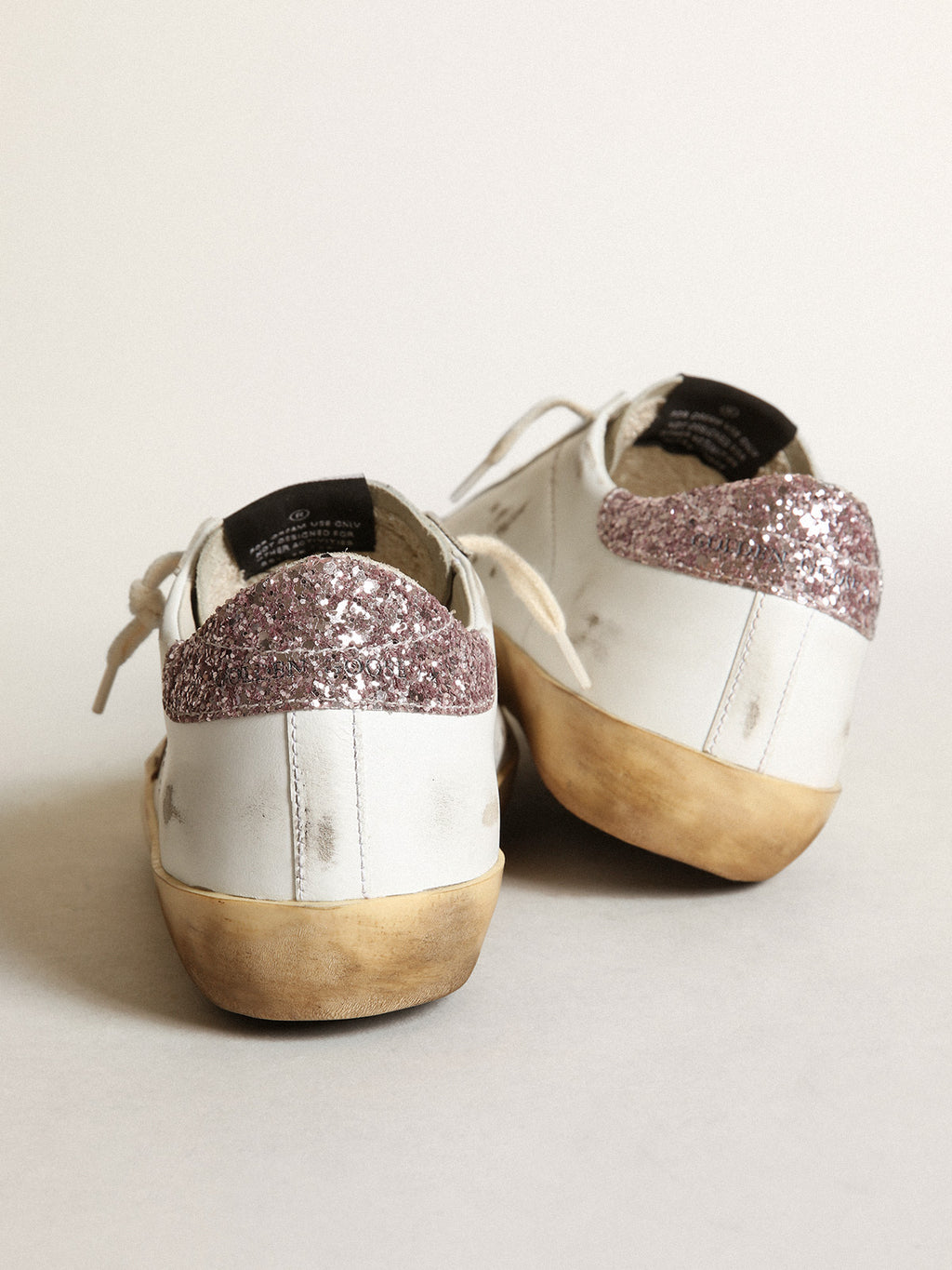 Super-Star with a tan star and pink glitter heel tab| Golden Goose