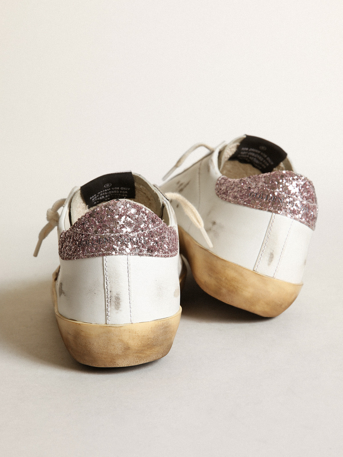 Super-Star with a tan star and pink glitter heel tab| Golden Goose