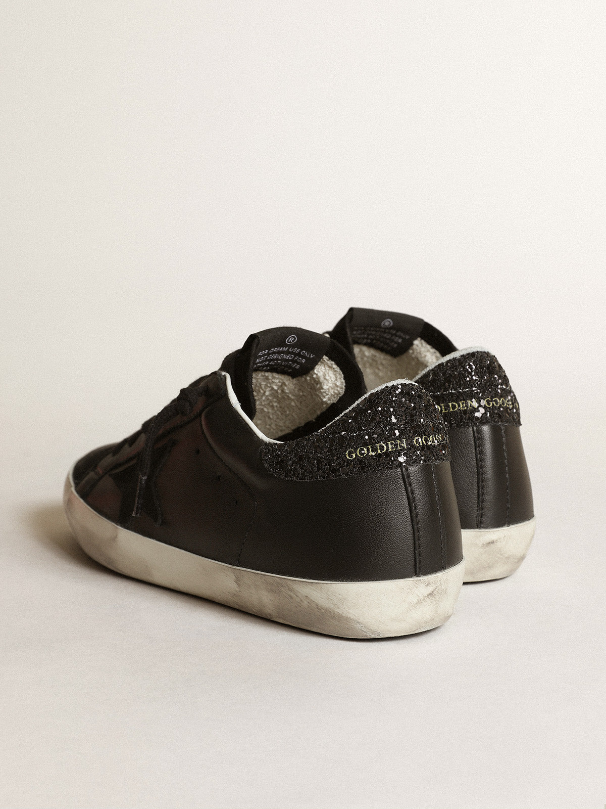 Super-Star in black nappa with black star and glitter heel tab| Golden Goose