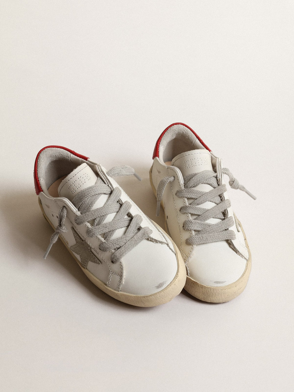 Super-Star Junior with suede star and red leather heel tab| Golden Goose