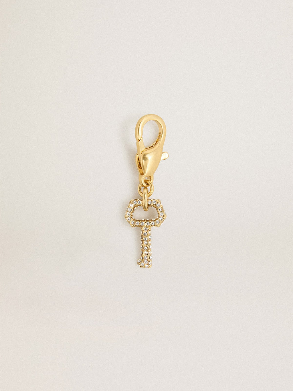 Key-shaped charm in gold-colored brass with crystals| Golden Goose