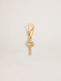 Key-shaped charm in gold-colored brass with crystals| Golden Goose